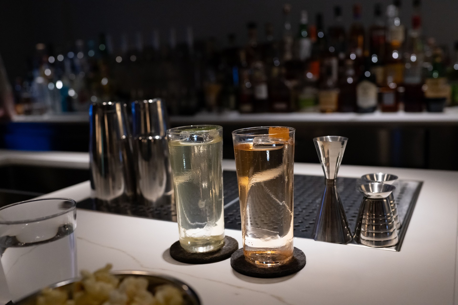 Elegant Cocktails with Mixing Tools in Low Light