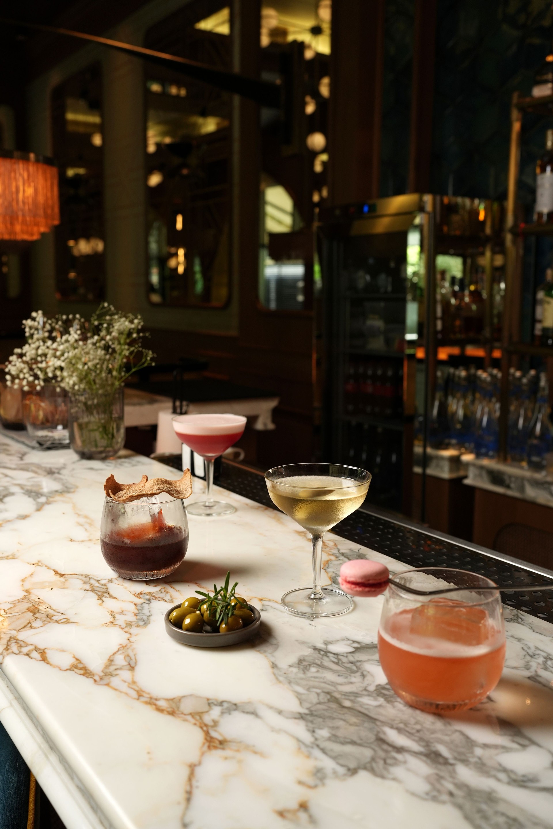 Set of various cocktails on bar counter. Assortment of alcoholic cocktails on restaurant bar